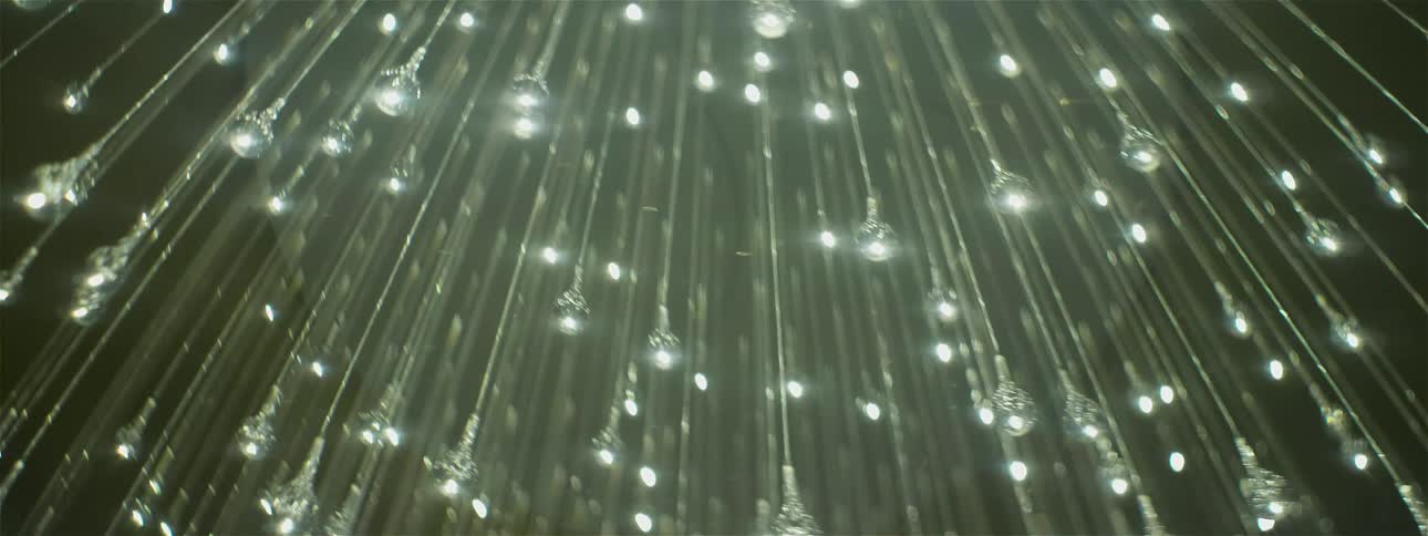 The chandelier has many lights hanging