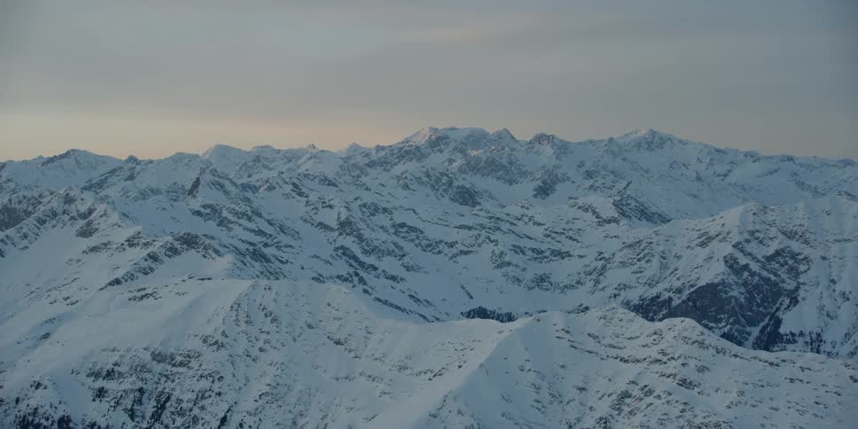 The mountain range is covered with ice and snow