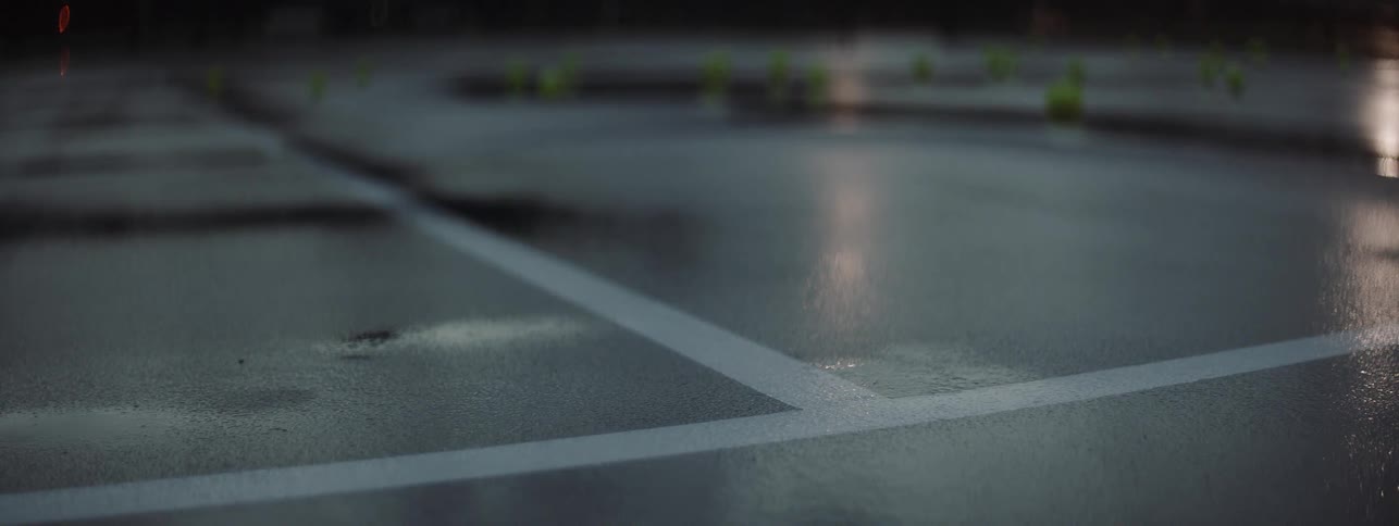 Tennis balls are hit on a court covered with rain