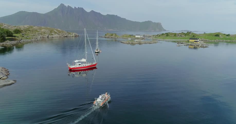 A boat is travelling along a very calm stretch of water