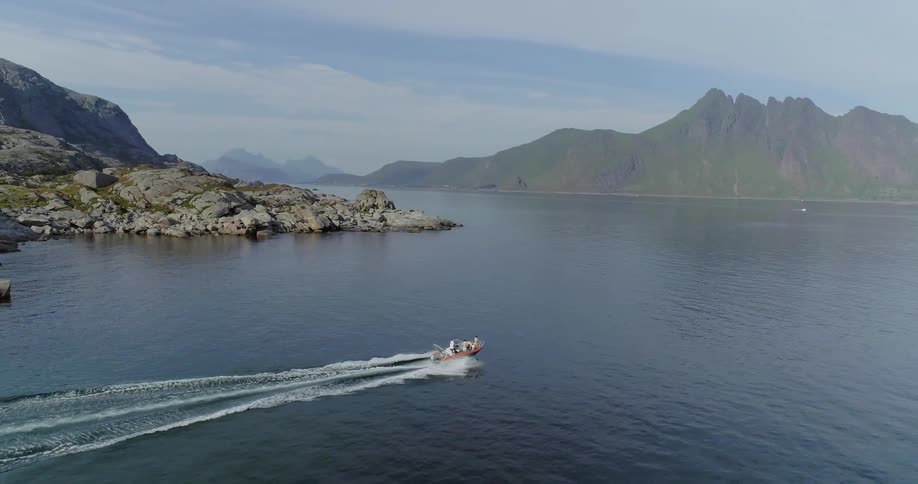 A boat floats on a mountain lake