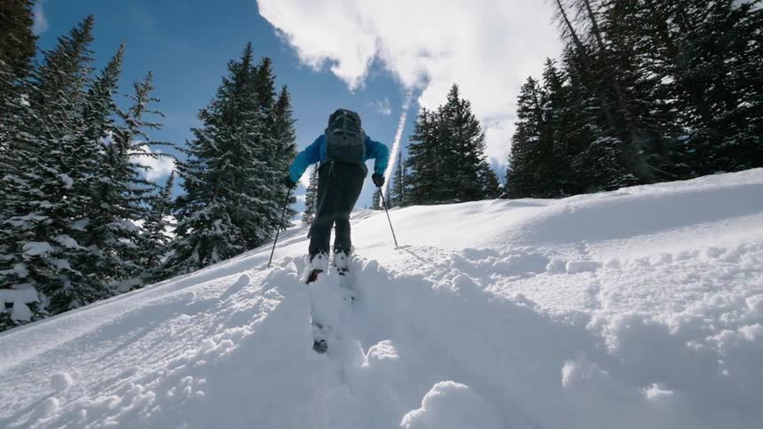 Person cross country skiing through the snow