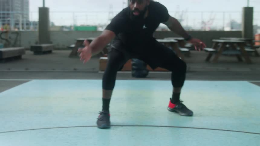 The man is exercising in the park