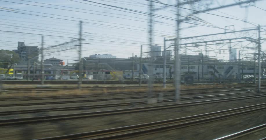 Sun shines over railroad tracks and trains