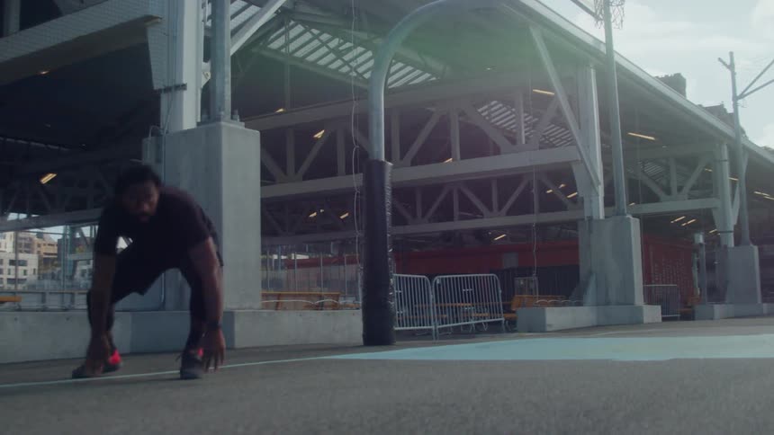 A man works out by sprinting to a line then running back