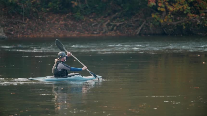 Man kayaks on a river