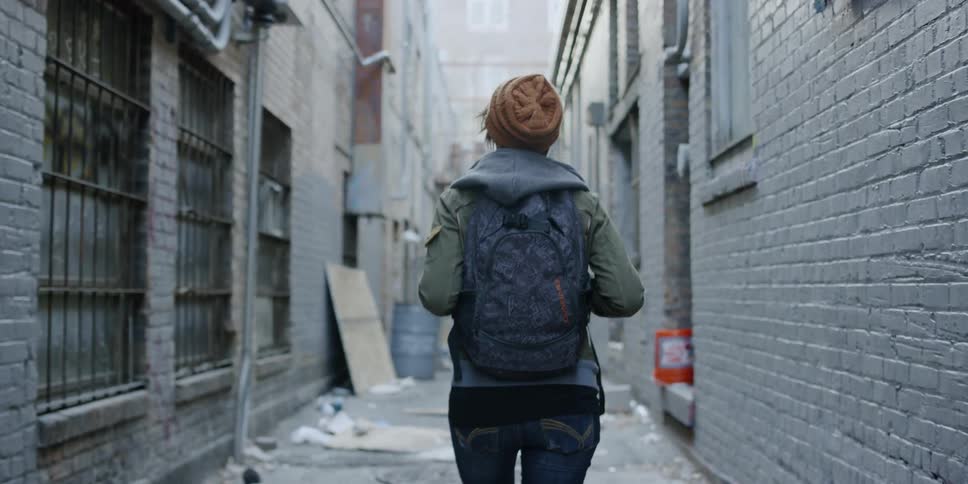 Woman walks in an alley