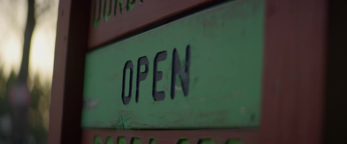 The green sign slides out that reads open