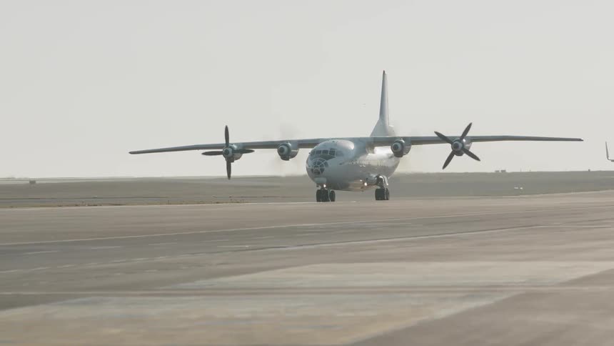 Airplane taxis down runway