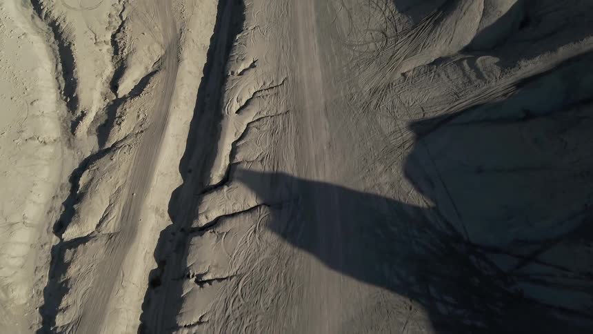 The canyons below are barren