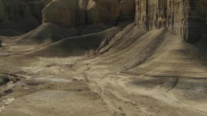 Sandy hilly desert with tall plateaus