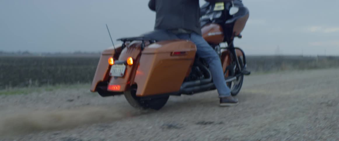 A man speeds off on the motorcycle