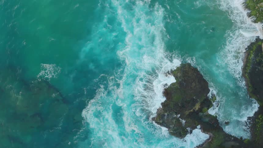 Waves flow onto the rocky shore