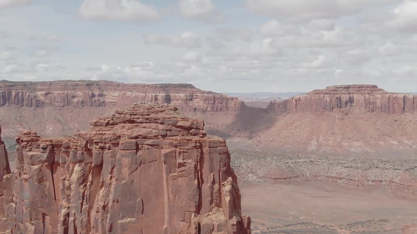 Red rock formations with striations on a sunny day