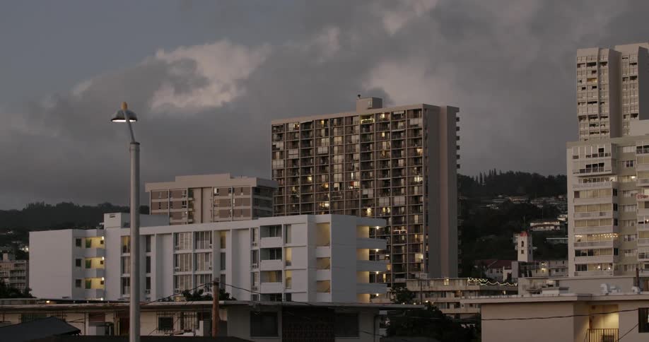 Several apartment buildings together in a city