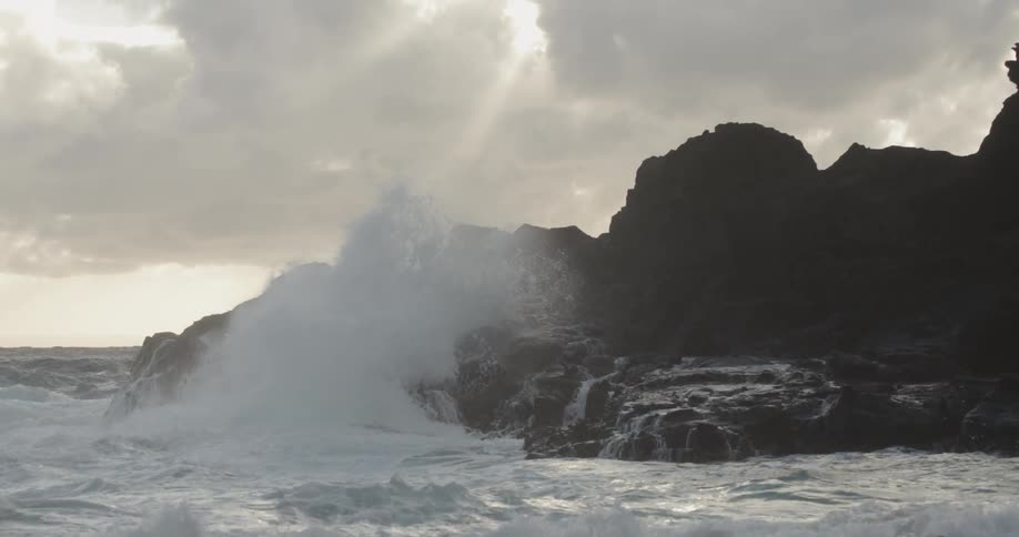 Waves crash into rocky shore
