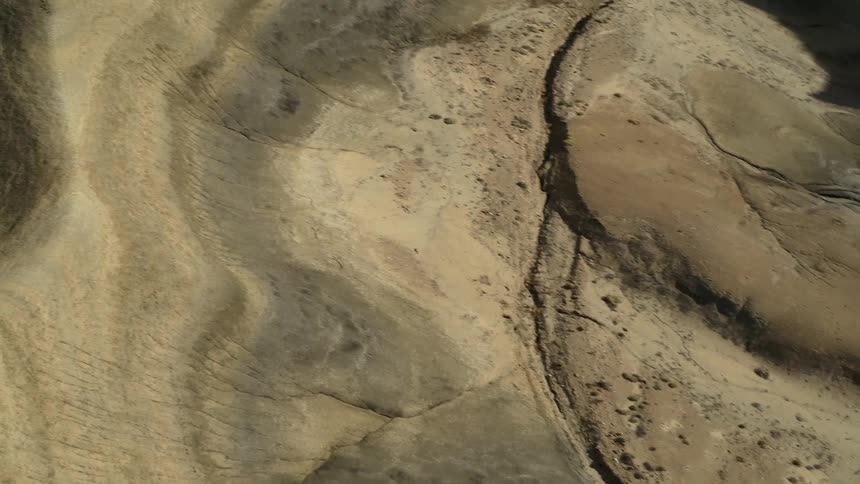 Dirt and hills cover a desert landscape