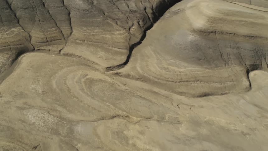 Hills and dirt cover a desert landscape