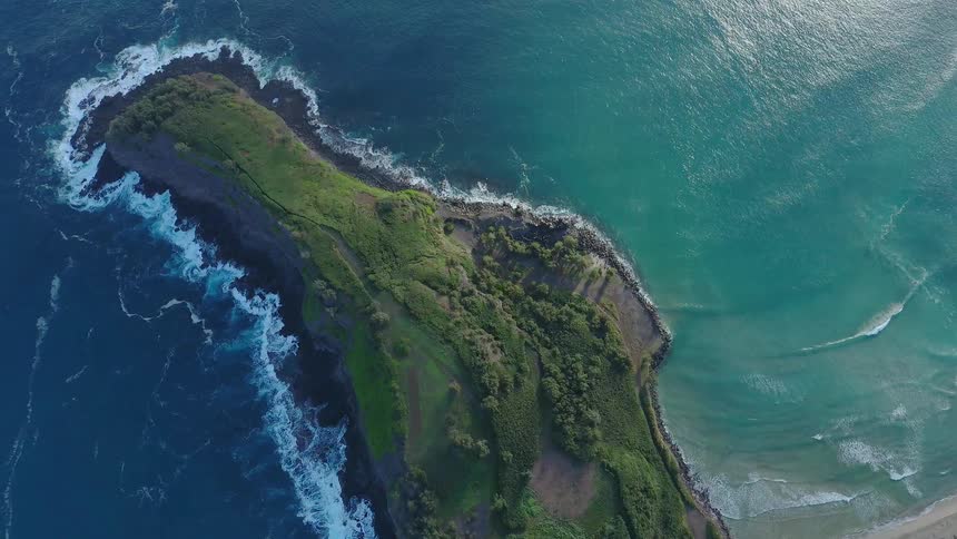 Ocean waves crash into a shoreline