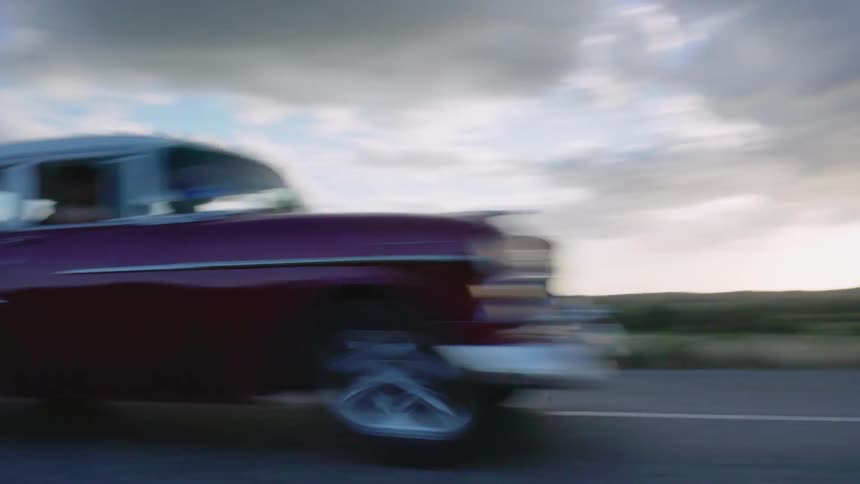 Car drives on a rural road