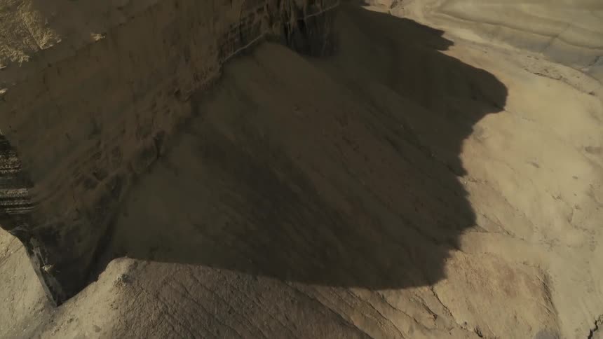 Shadows over hilly desert