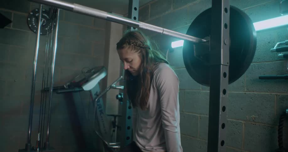 Woman rests in a gym