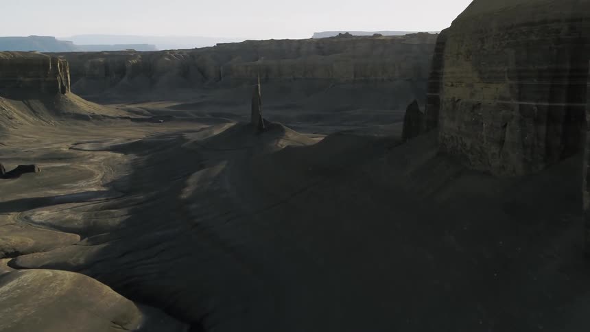 Rock formations stand in a desert