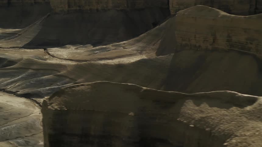 Rock formations stand in a desert