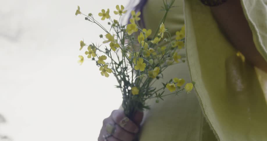 Woman holds a bouquet of flowers