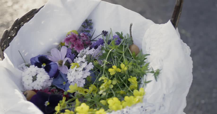 Cloth lined basket of fresh flowers