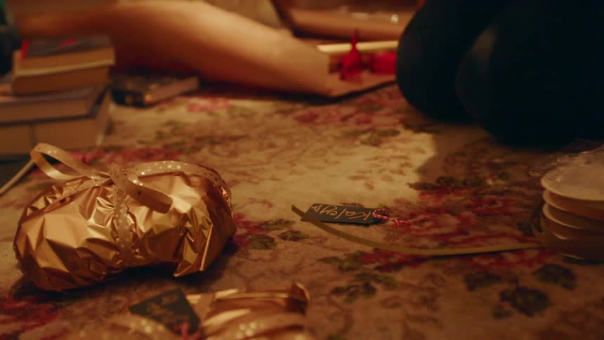 Woman puts a tag on a present