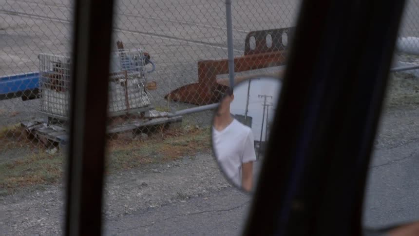A man is reflected in a side view road