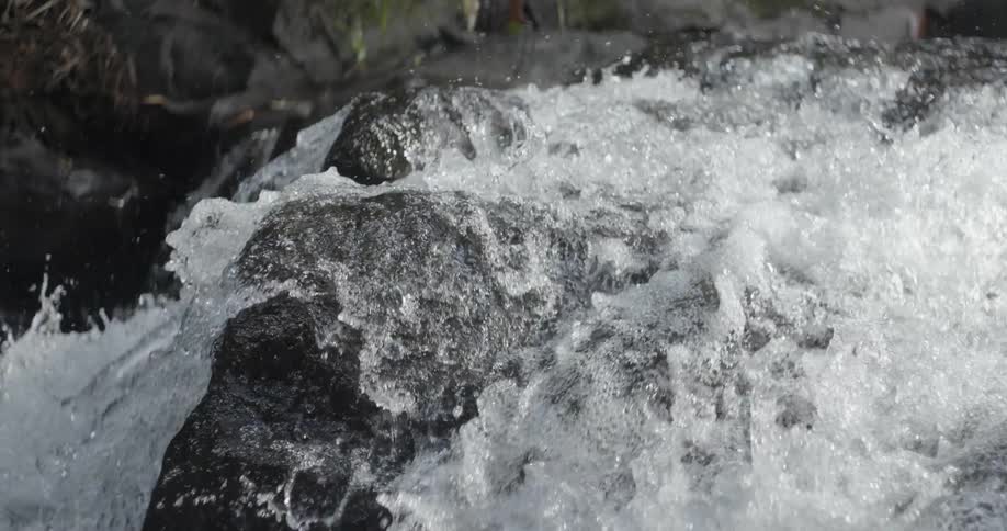 Water splashes and cascades over the rocks