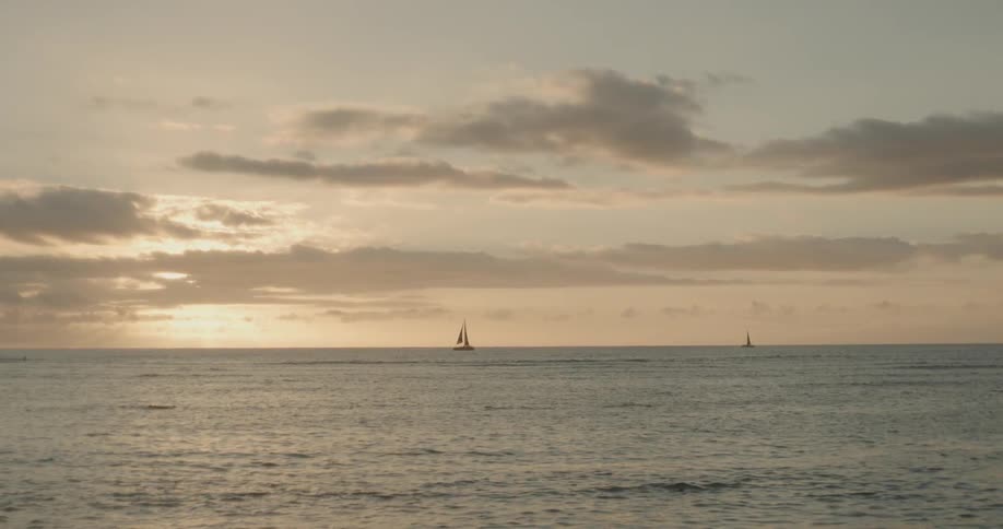 Sun sets over a large body of waer