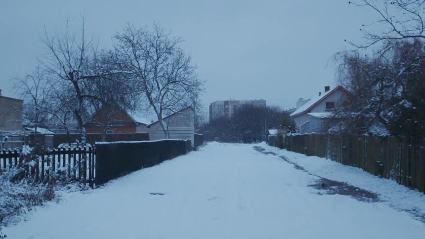 Snow covers the ground in a town