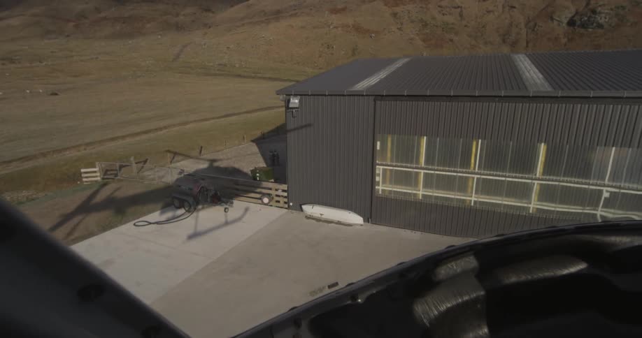 Shadow of a helicopter taking off from a platform