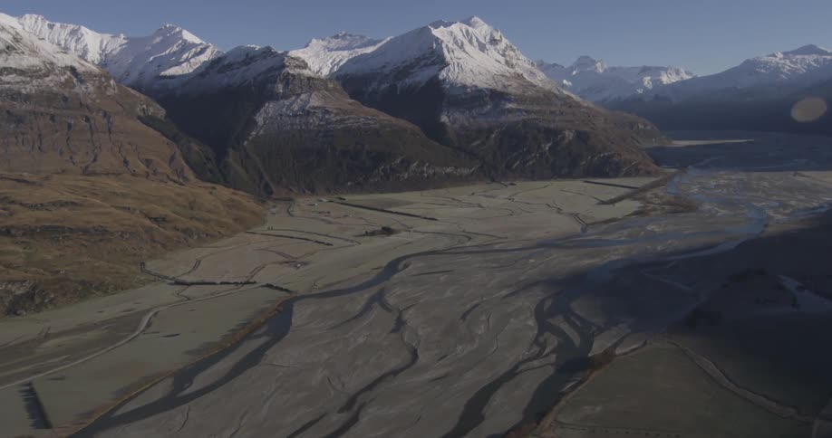 Aerial view of snow covered mountains are displayed