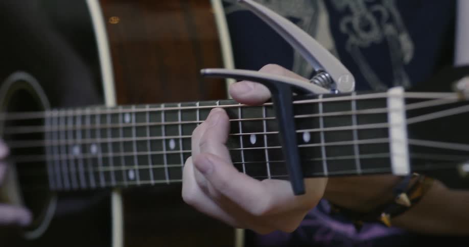 Man plays acoustic guitar