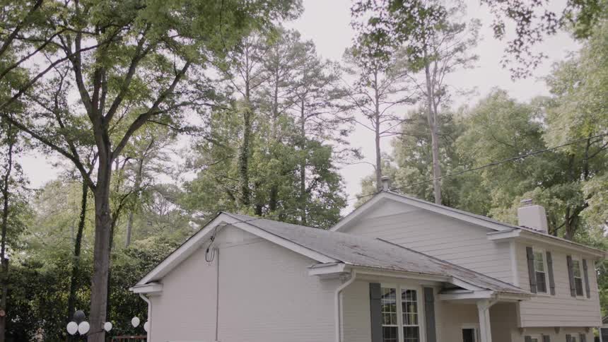 White house sits near the trees