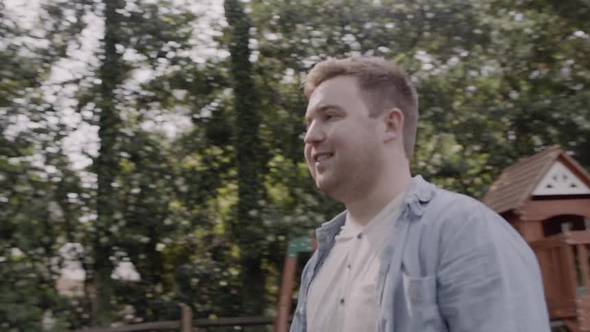 A man plays out in the yard