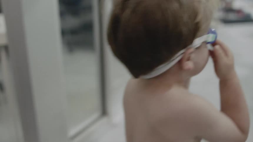 Child put goggles on and walks away