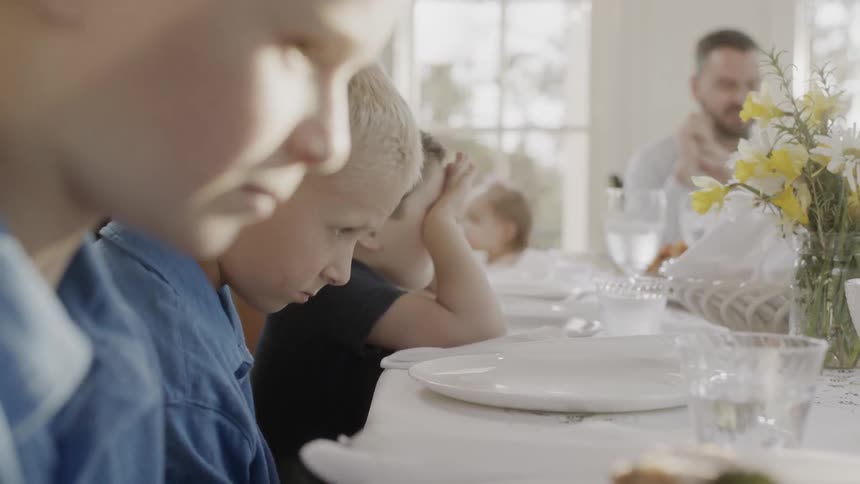A family dines together at the table