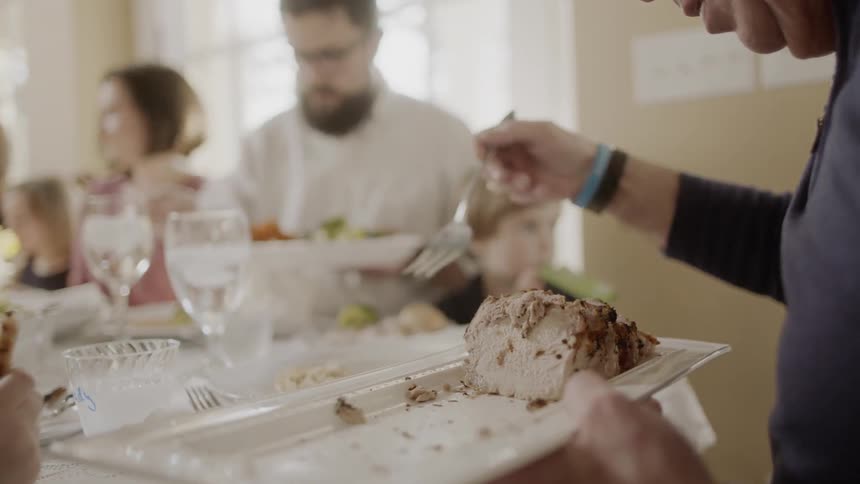 People sit down to a meal at a table