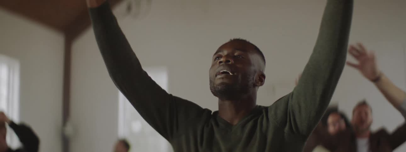 Man waves his hands in the air