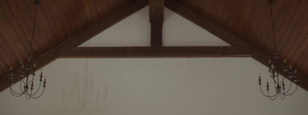 The wooden ceiling and beams of a building