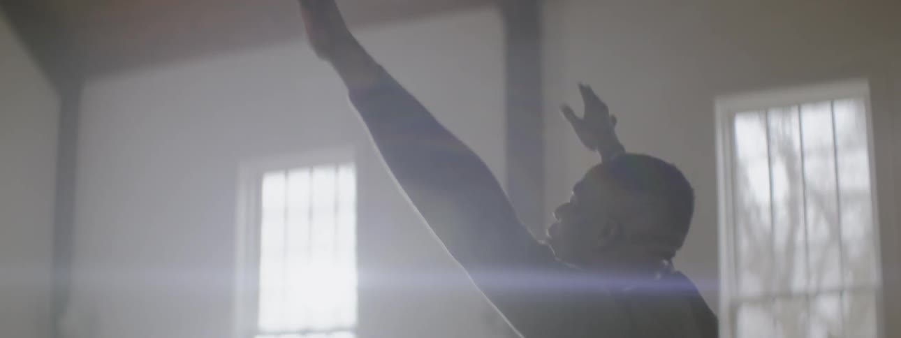 A man is waving his arms in church