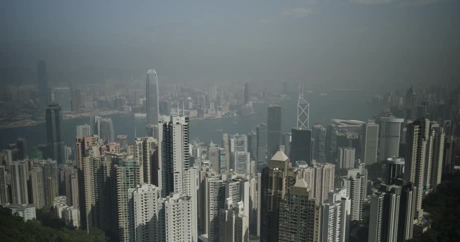 Tall buildings line the side of the mountain below