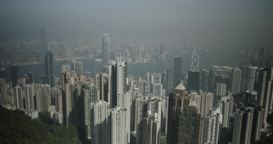 A hazy sky over a city skyline