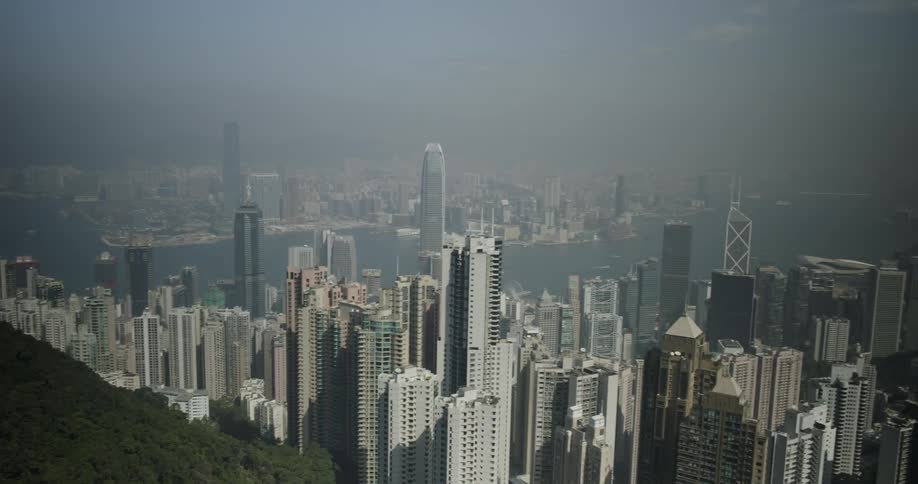 The city has many tall buildings and fog all over