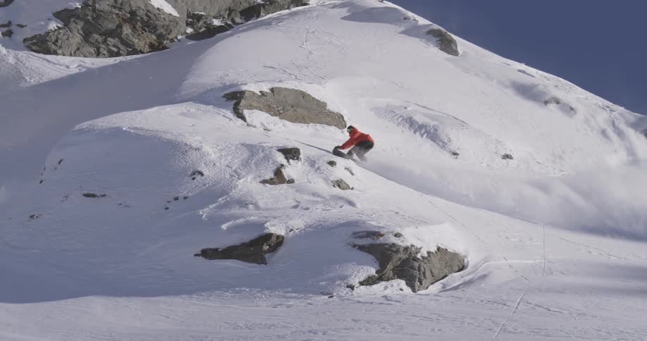A person snowboarding on a snowy mountain